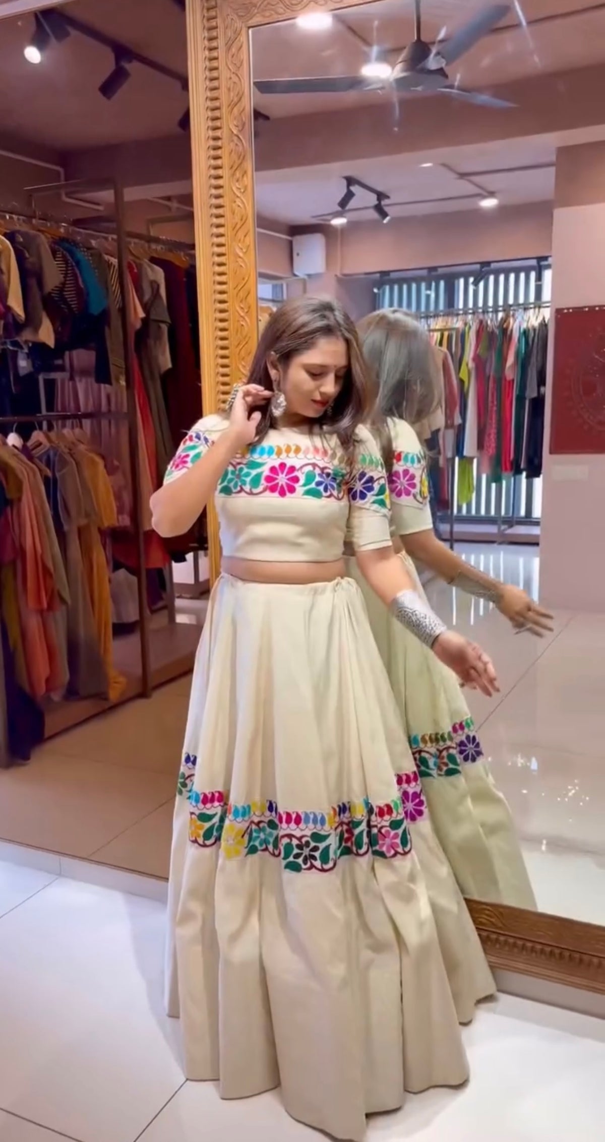 Off-white Navratri lehenga choli with embroidered blouse