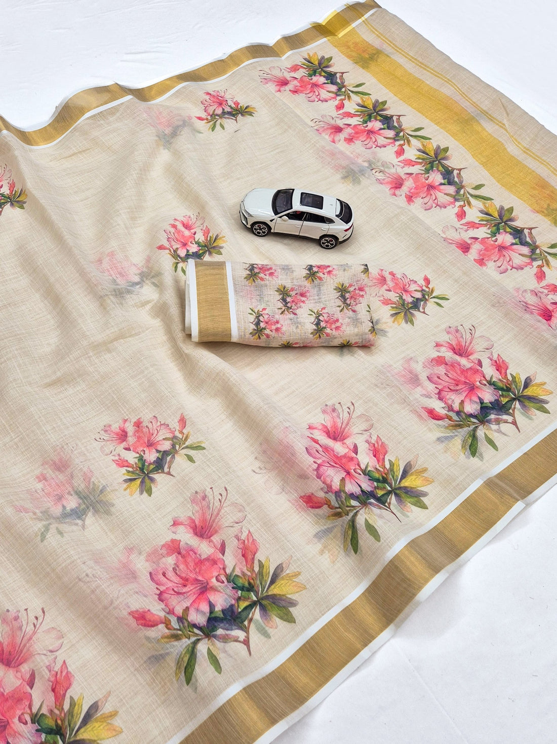 Baby Pink Linen Floral Print Saree with Zari Border