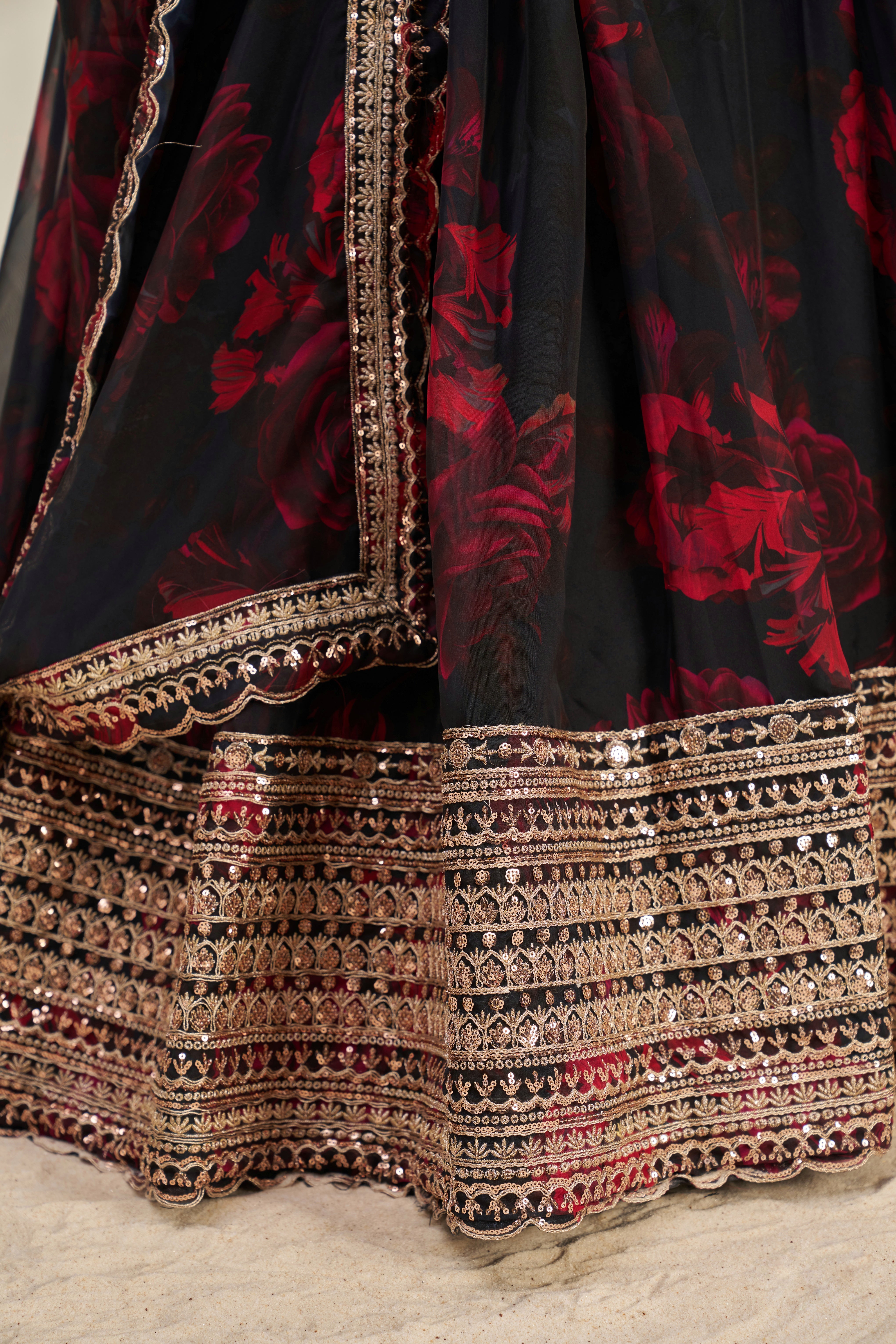 Black Organza Lehenga Choli Featuring Red Floral Prints