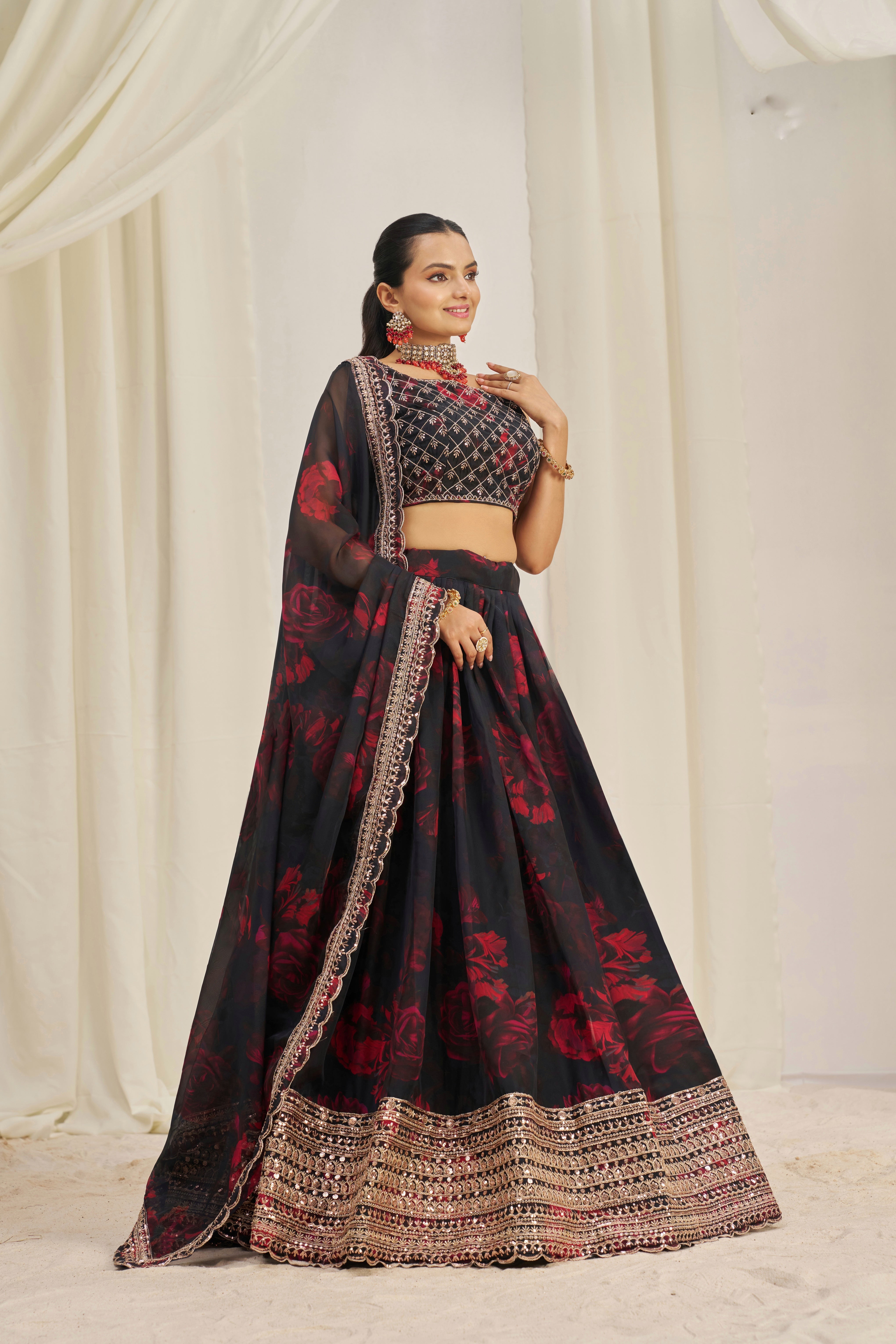 Black Organza Lehenga Choli Featuring Red Floral Prints