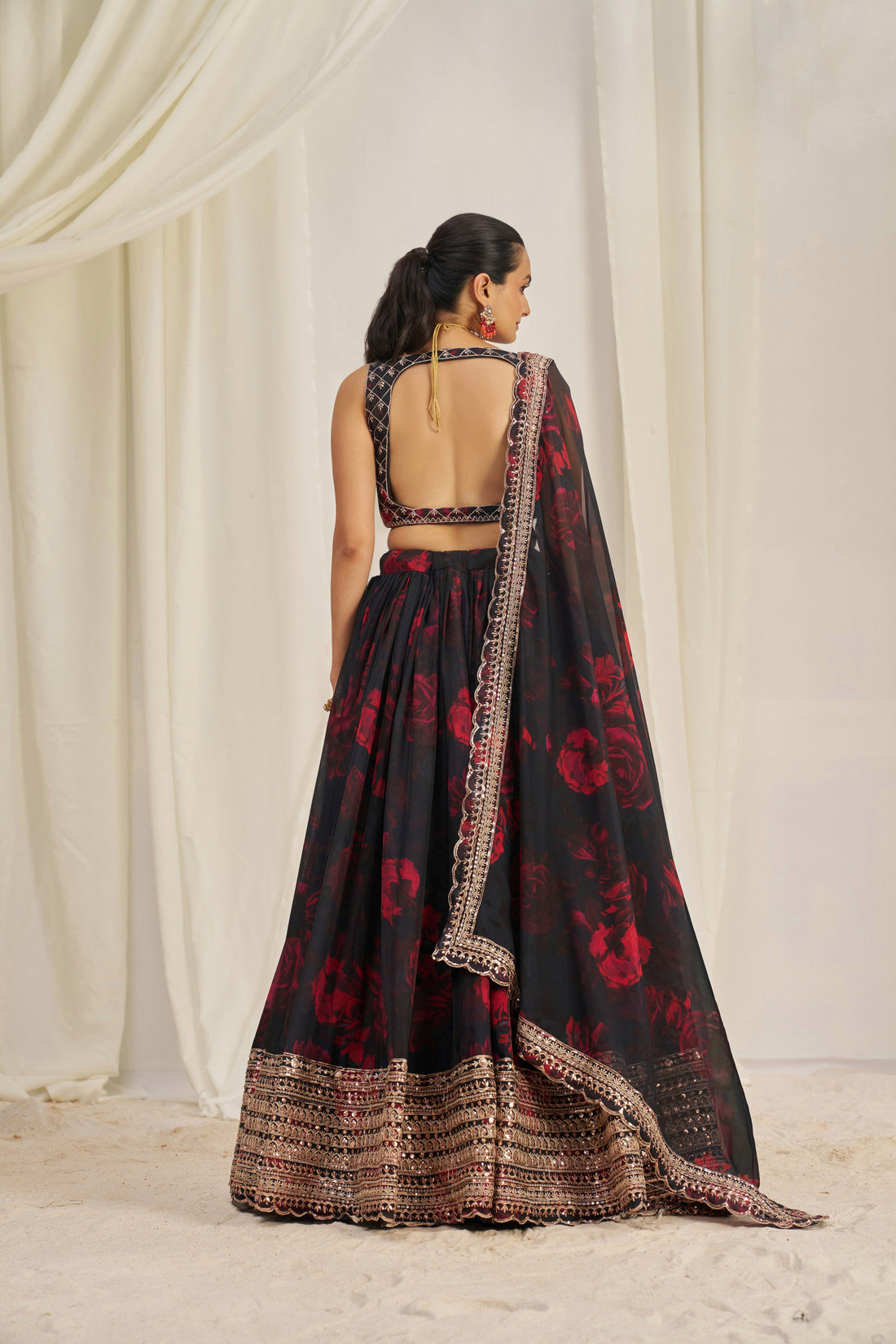 Black Organza Lehenga Choli Featuring Red Floral Prints