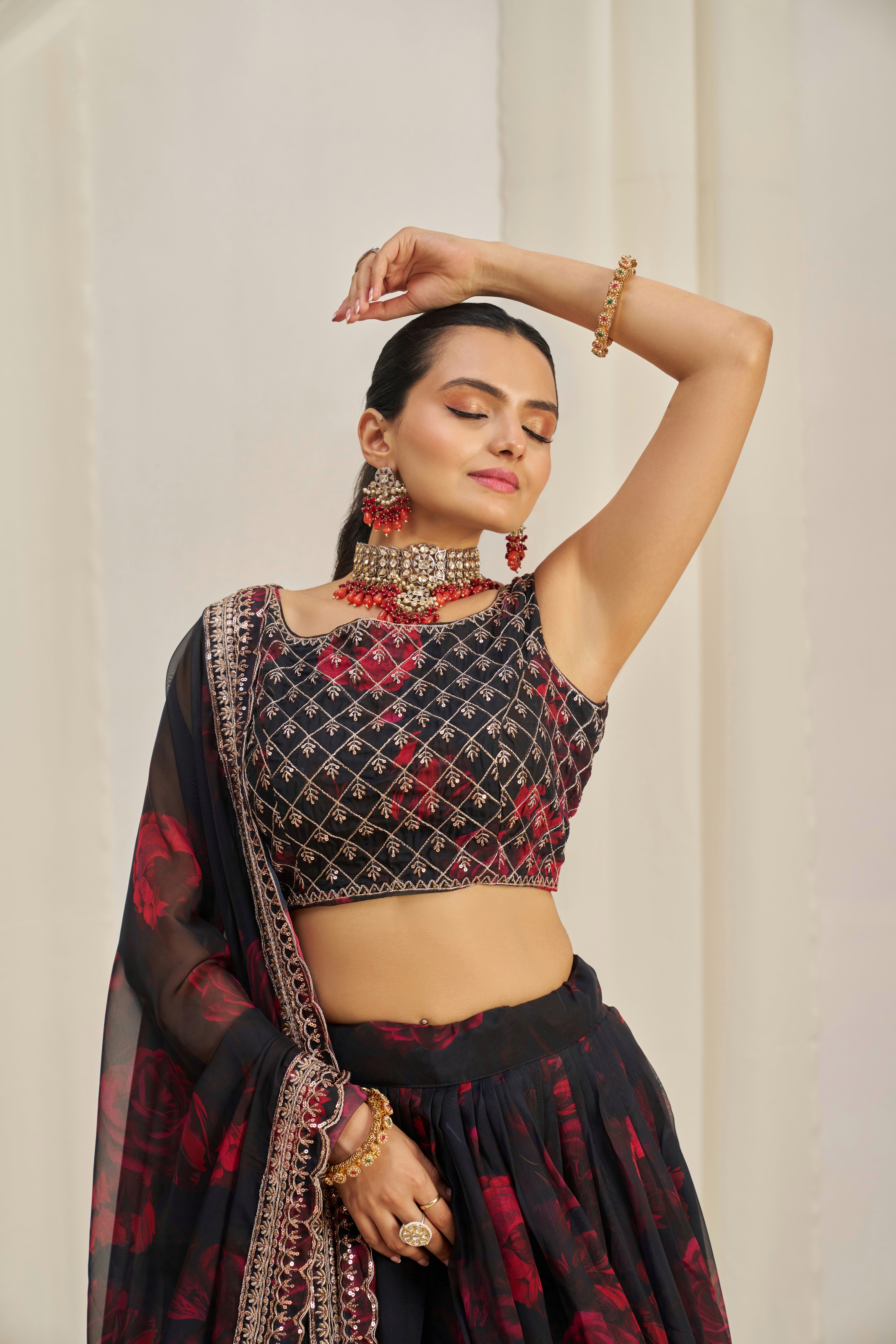 Black Organza Lehenga Choli Featuring Red Floral Prints