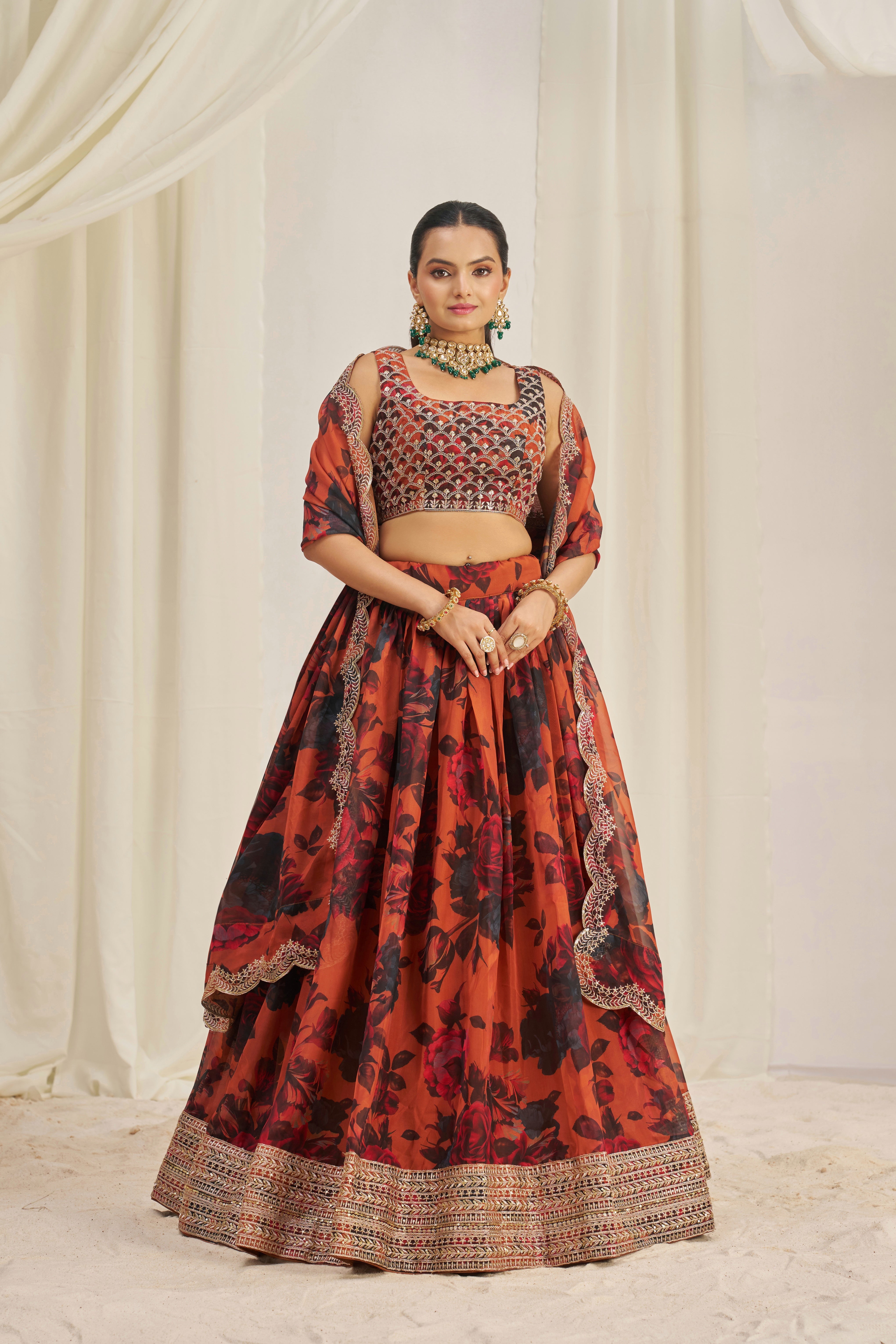 Lehenga Set Features A Vibrant Orange & Black Floral Print On Organza Fabric