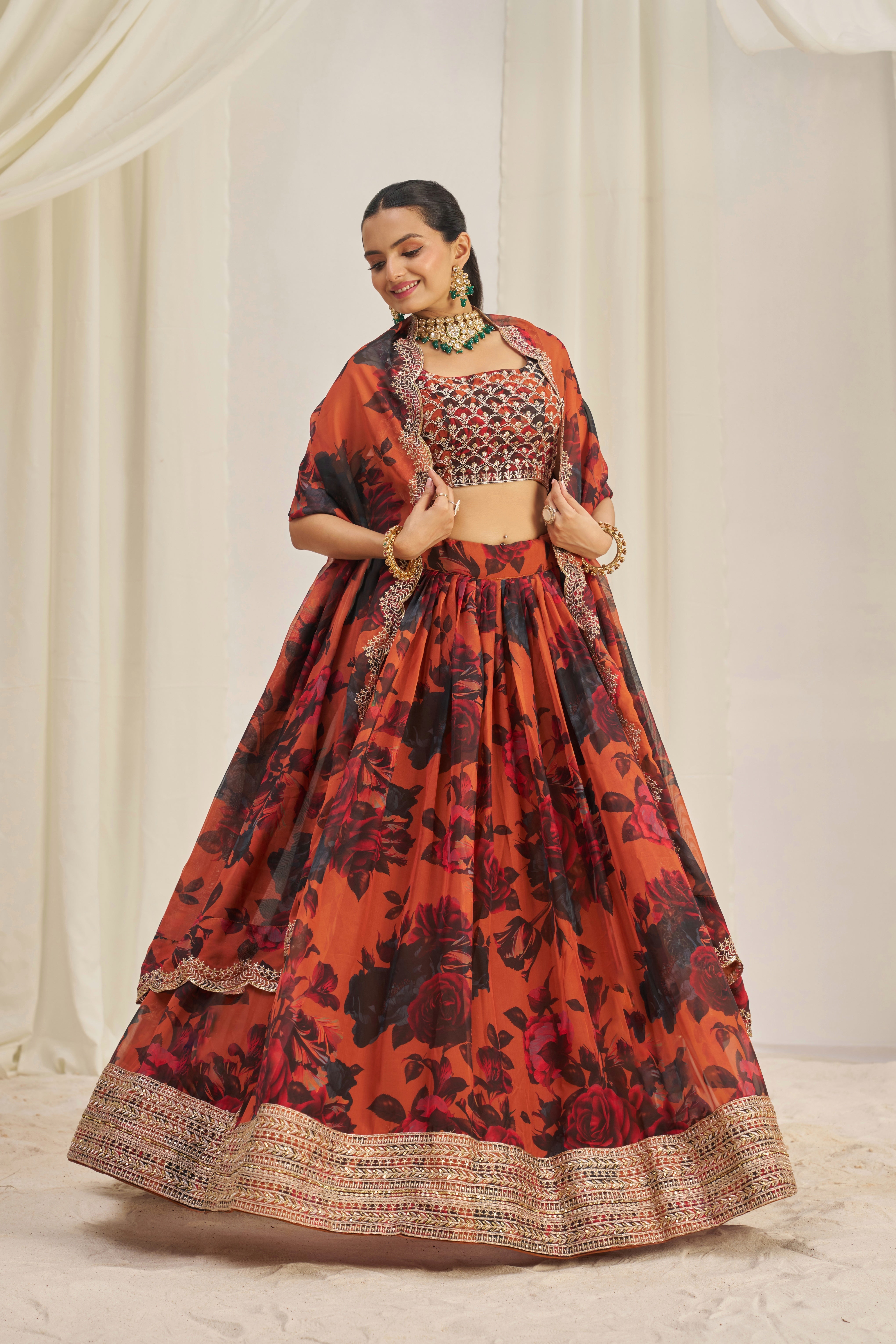 Lehenga Set Features A Vibrant Orange & Black Floral Print On Organza Fabric