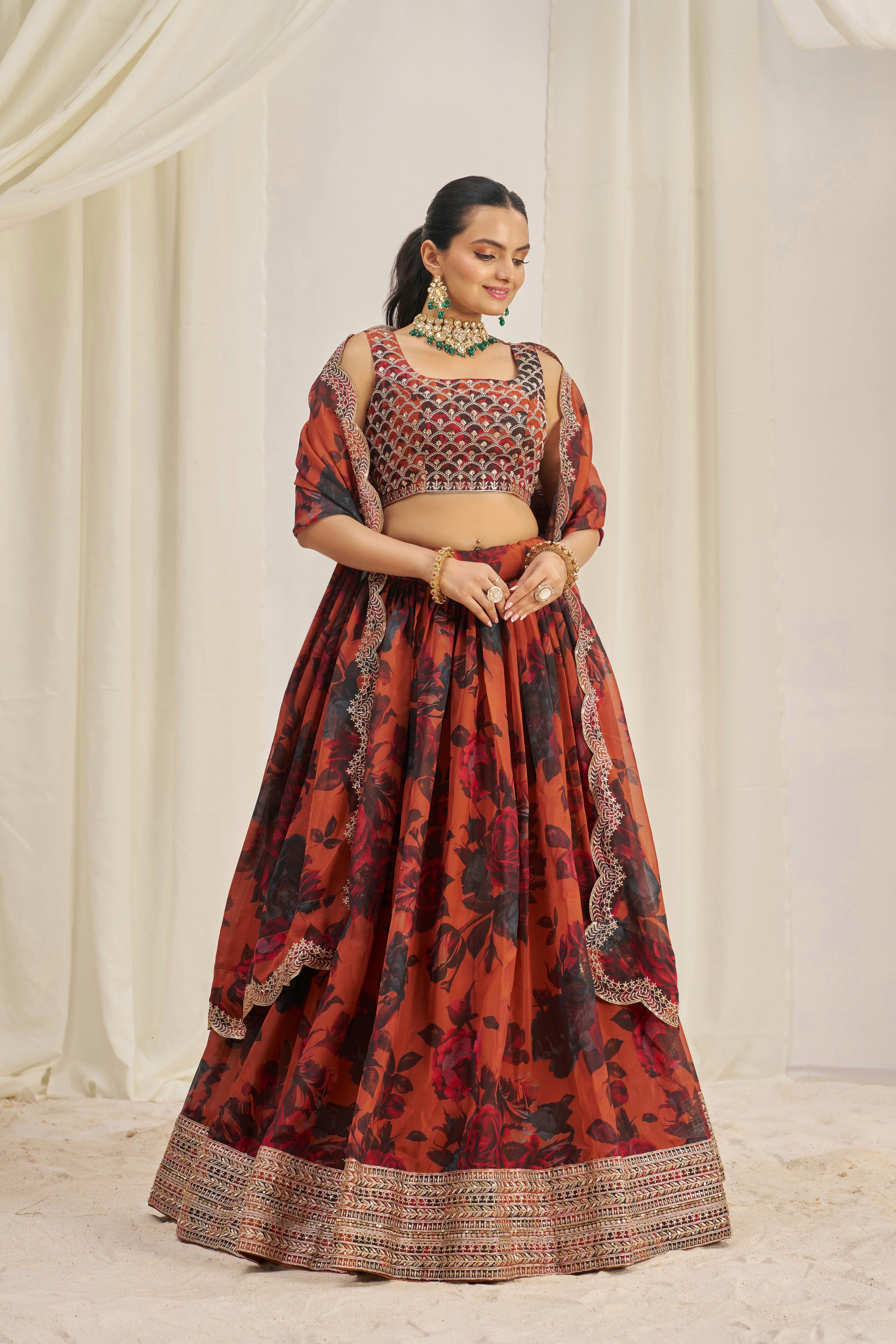 Lehenga Set Features A Vibrant Orange & Black Floral Print On Organza Fabric