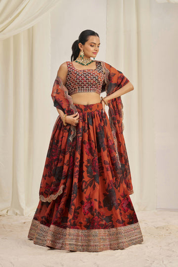 Lehenga Set Features A Vibrant Orange & Black Floral Print On Organza Fabric