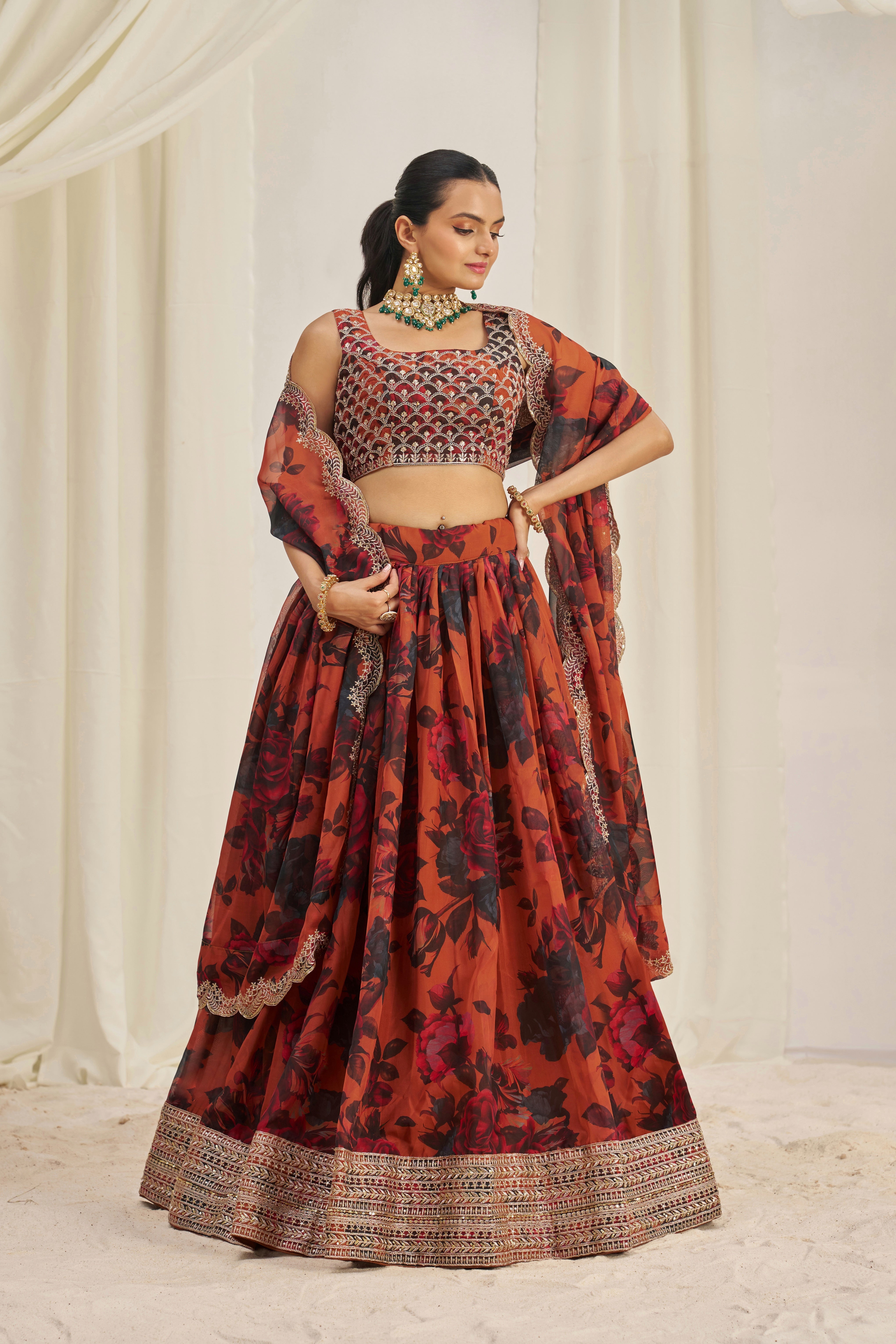 Lehenga Set Features A Vibrant Orange & Black Floral Print On Organza Fabric