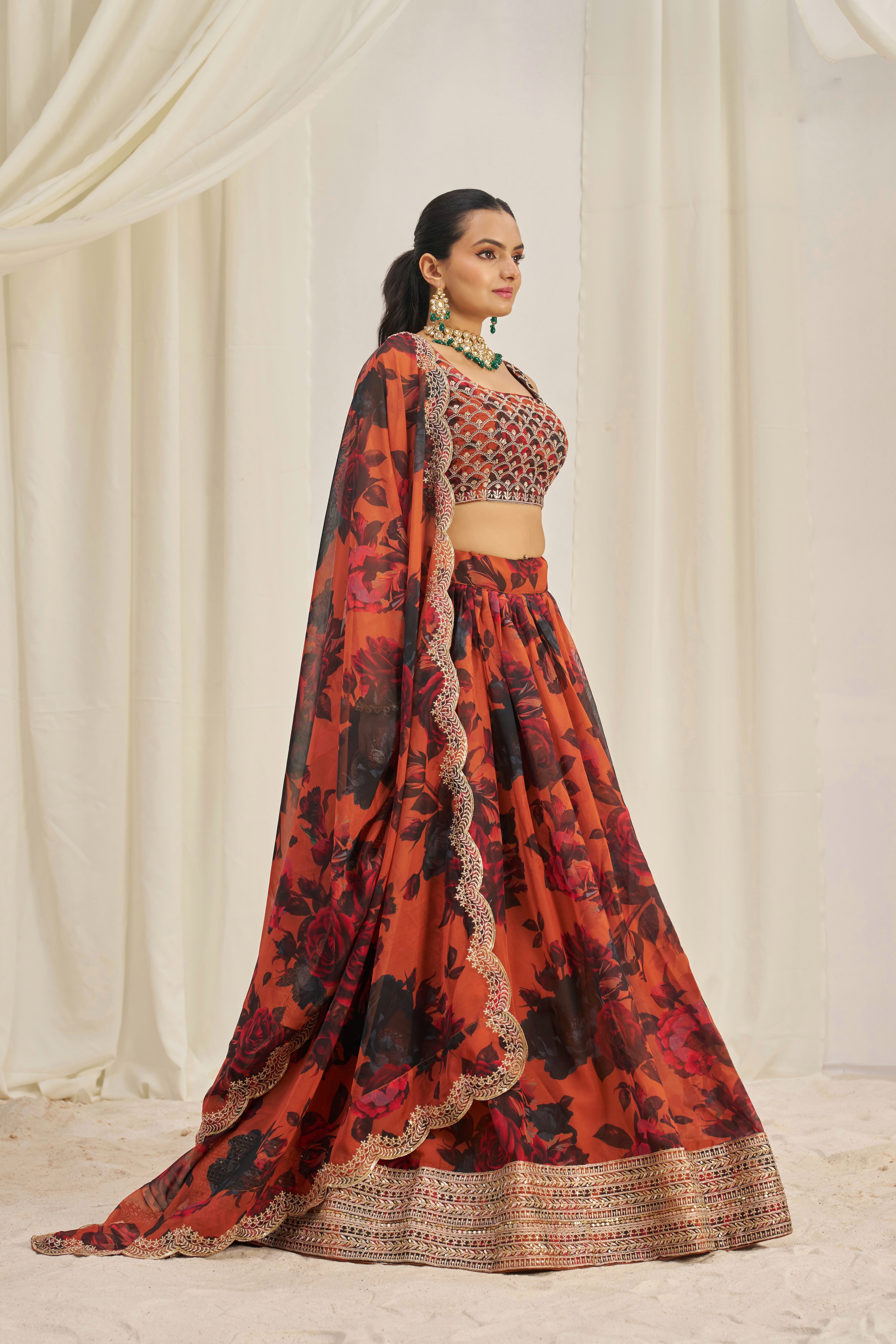 Lehenga Set Features A Vibrant Orange & Black Floral Print On Organza Fabric